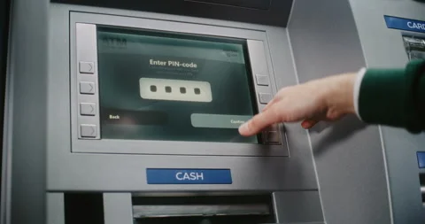 ATM User Entering PIN Code on ATM Keypad. Error Message on Cash Machine Due to Stock Footage 310114917