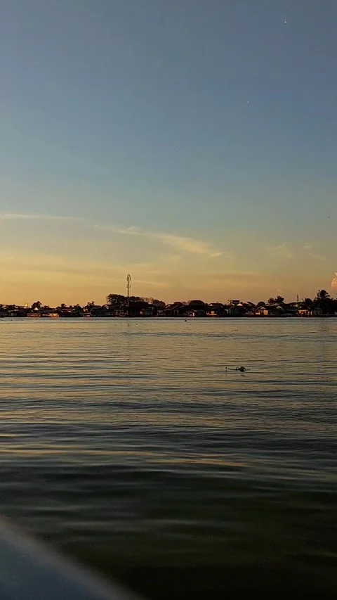 The atmosphere of the evening sunset on the river bank Stock-Footage 303754011