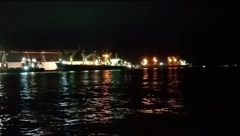 The atmosphere of the harbor can be seen from afar with a background of darkness Stock Footage 277306395