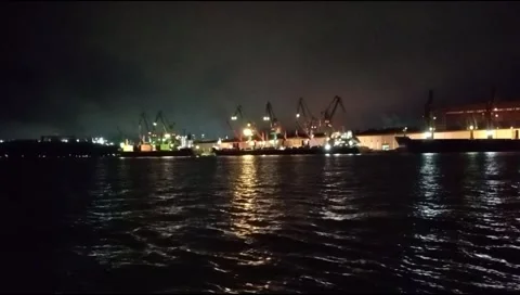 The atmosphere of the harbor can be seen from afar with a background of darkness Stock Footage 277306396