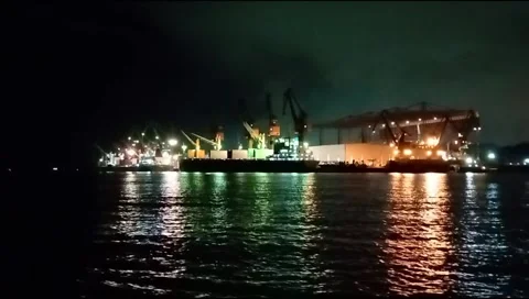 The atmosphere of the harbor can be seen from afar with a background of darkness Stock Footage 277306535