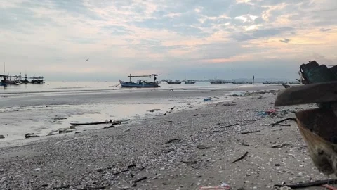 The atmosphere of Tuban beach, East Java, Indonesia in the morning with fishing  Stock Footage 323579345