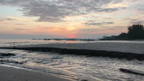 The atmosphere of Tuban beach, East Java, Indonesia in the morning Stock Footage 323579346
