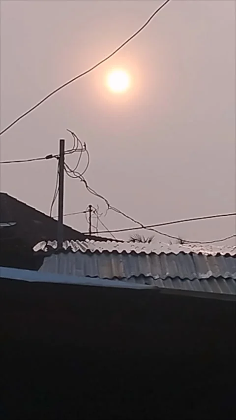 The atmosphere was cloudy and the sun looked orange in the morning Stock Footage 293261224