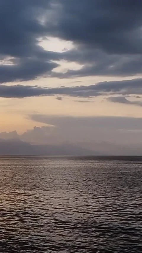 The atmosphere of the weighing beach waves in the afternoon is very calm Stock Footage 225486653