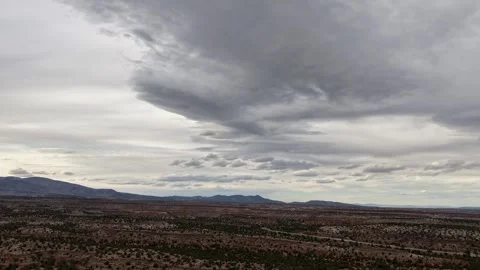 Atmospheric 4K Drone Timelapse of a Layered Cloudscape over Southwestern Desert Stock Footage 334565801