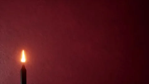 Atmospheric burning candle animation with dark red textured background 스톡 동영상 340637522