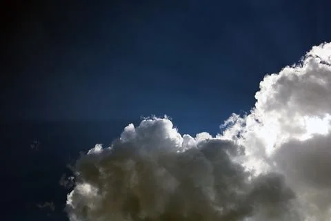 Atmospheric clouds on a black sky background Stock Photos