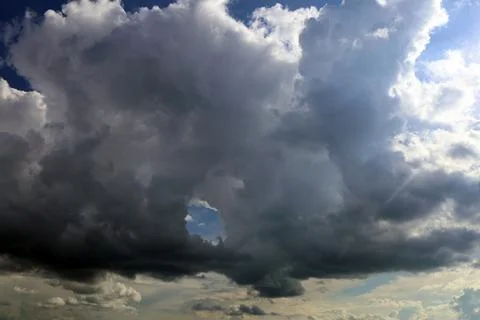 Atmospheric clouds on a black sky background Stock Photos