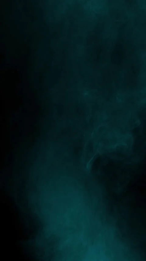 Atmospheric cyan mist on black background, vertical format Stock Footage 340134451