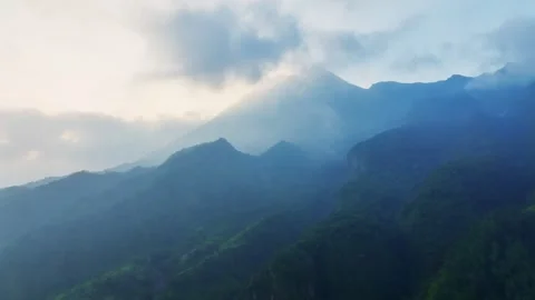 Atmospheric Drone View of Layered Mountain Ranges at Sunrise in Central Java Vídeos de archivo 341353352