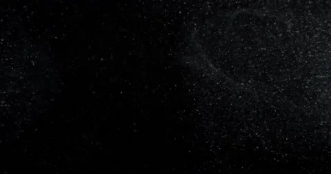 Atmospheric dust particles on black screen overlay. Filmed with RED camera in Stock Footage 230402830
