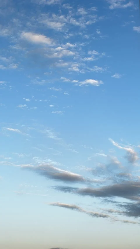 Atmospheric evening sky time lapse with dark cloud moving across blue horizon Video stock 338131668