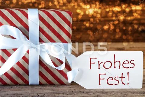 Atmospheric Gift With Label, Frohes Fest Means Merry Christmas Stock Photos