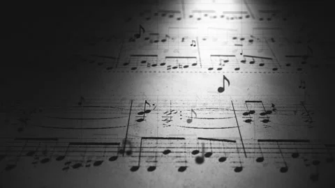 Atmospheric music background with notes on old paper in black and white Stock Footage 87483901