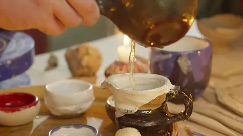 Atmospheric setting of pouring tea into cups at class. Stock Footage 249108679
