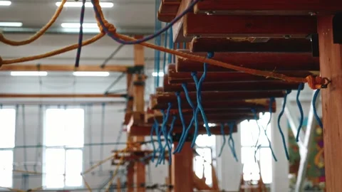An atmospheric shot from a rope park with elements of an obstacle equipment Stock Footage 275811425