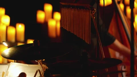 An atmospheric stage with candles and a drum kit. Bar Chimes cymbals Stock Footage 287676023