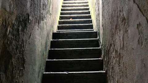 Atmospheric Stone Stairwell _  upwards camera tilt Stock Footage 59592587