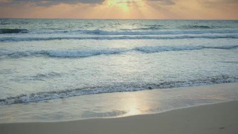 Atmospheric sunset over the sea. Reflection of the setting sun on the seascape Stock Footage 310543705