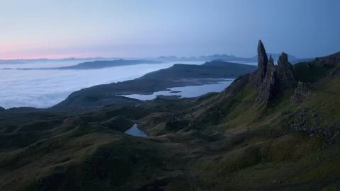 Atmospheric top view of the high sharp cliffs towering over the lakes and the Stock Photos