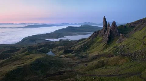 Atmospheric top view of the high sharp cliffs towering over the lakes and the Stock Photos