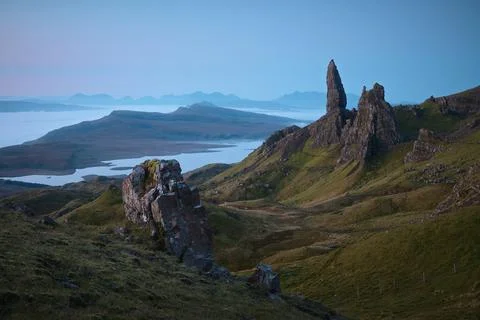 Atmospheric view from above of the tall, sharp cliffs overlooking the lake and Stock Photos
