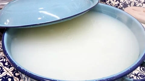 Atole Simmering in Blue Pot on Patterned Kitchen Counter, Traditional Mexican Stock Footage 344457865