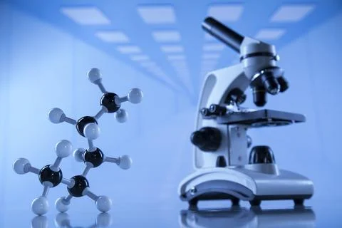 Atom, Microscope,  Laboratory background Stock Photos