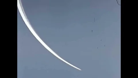 An atomic bomb explodes into a mushroom cloud after it is dropped by a Convair 動画素材 94062549