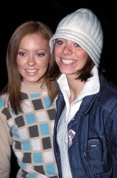  ATOMIC KITTEN - NATASHA &amp; LIZ Ref: 10077 woolly hat, smiling, patterned j... Stock Photos