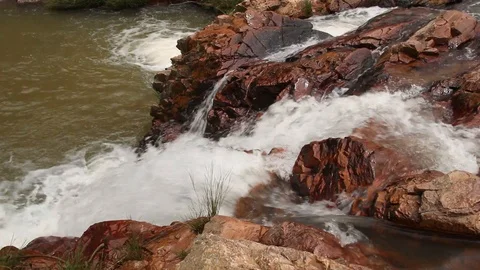 Atop a Small Waterfall Looking Down Stock Footage 104165876