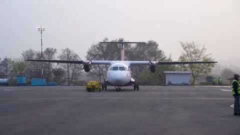 ATR airplane getting ready for flight in Nepal TIA Stock Footage 238020291