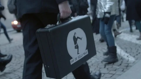 Attache case on International Day of Silly Walk, Brno, Czech Stock Footage 101071533
