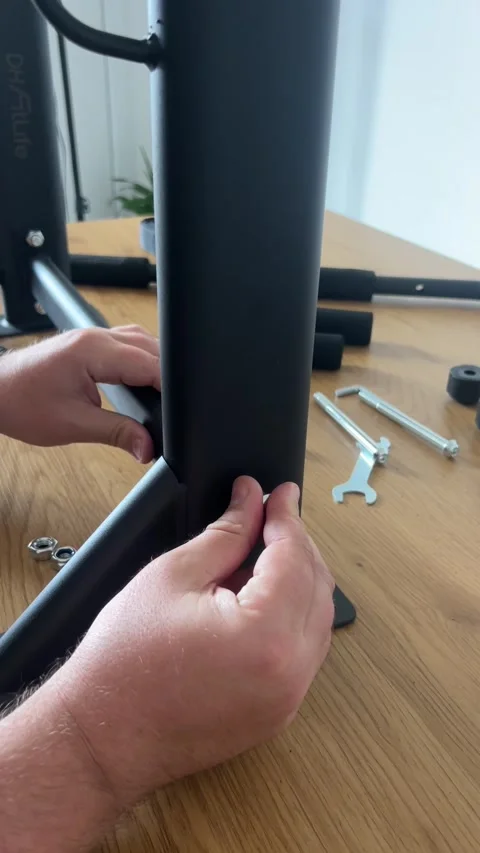 Attaching Base to Pull-Up Bar Post Stock Footage 311020349