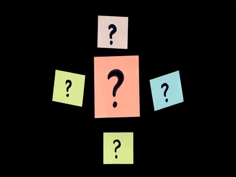 Attaching colorful post it with question mark on black background Stock Footage 80899008