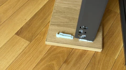 Attaching drawer box structure to wooden front panel close up furniture assembly Stockbeeldmateriaal 333788874