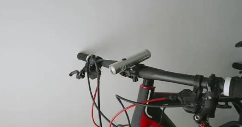 Attaching flashlight mount on handlebar in bicycle. Stock Footage 220531830