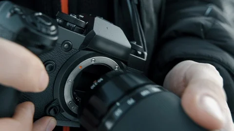 Attaching the lens to the camera Stock Footage 108030796