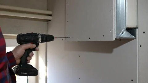 Attaching paneling to a raised section of wall in a room Stock Photos