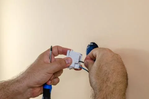 Attaching wires to a light switch Stock Photos