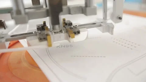 Attachment of elastic ear loops of protective masks n95 Stock Footage 138523049