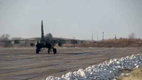 Attack aircraft Su-25SM (NATO: Frogfoot) steers in direction of runway. Close-up Stock Footage 122734341
