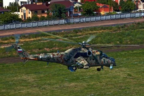 Attack helicopter Mi-35P in flight, view from a parallel helicopter (export v Stock Photos