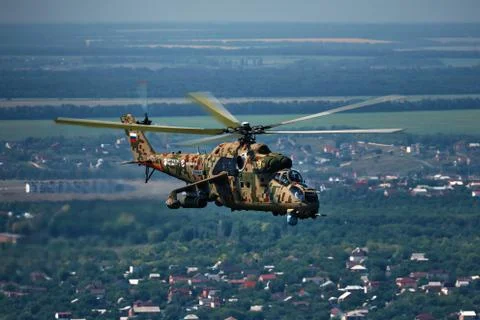 Attack helicopter Mi-35P in flight, view from a parallel helicopter (export v Stock Photos