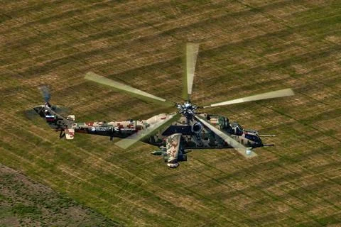 Attack helicopter Mi-35P in flight, view from a parallel helicopter (export v Stock Photos
