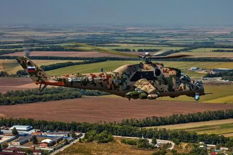 Attack helicopter Mi-35P in flight, view from a parallel helicopter (export v Stock Photos