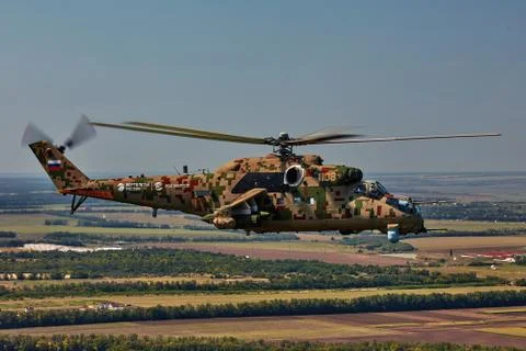 Attack helicopter Mi-35P in flight, view from a parallel helicopter (export v Stock Photos