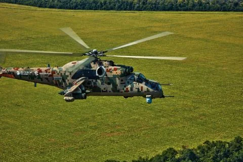 Attack helicopter Mi-35P in flight, view from a parallel helicopter (export v Stock Photos