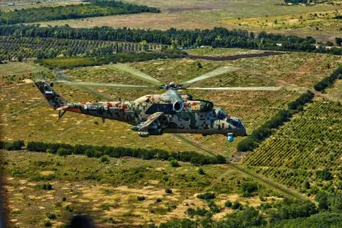 Attack helicopter Mi-35P in flight, view from a parallel helicopter (export v Stock Photos